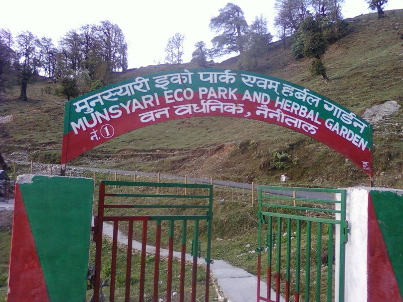 The entrance gate of Munsiyari Eco Park and Herbal Garden, with green hillside behind