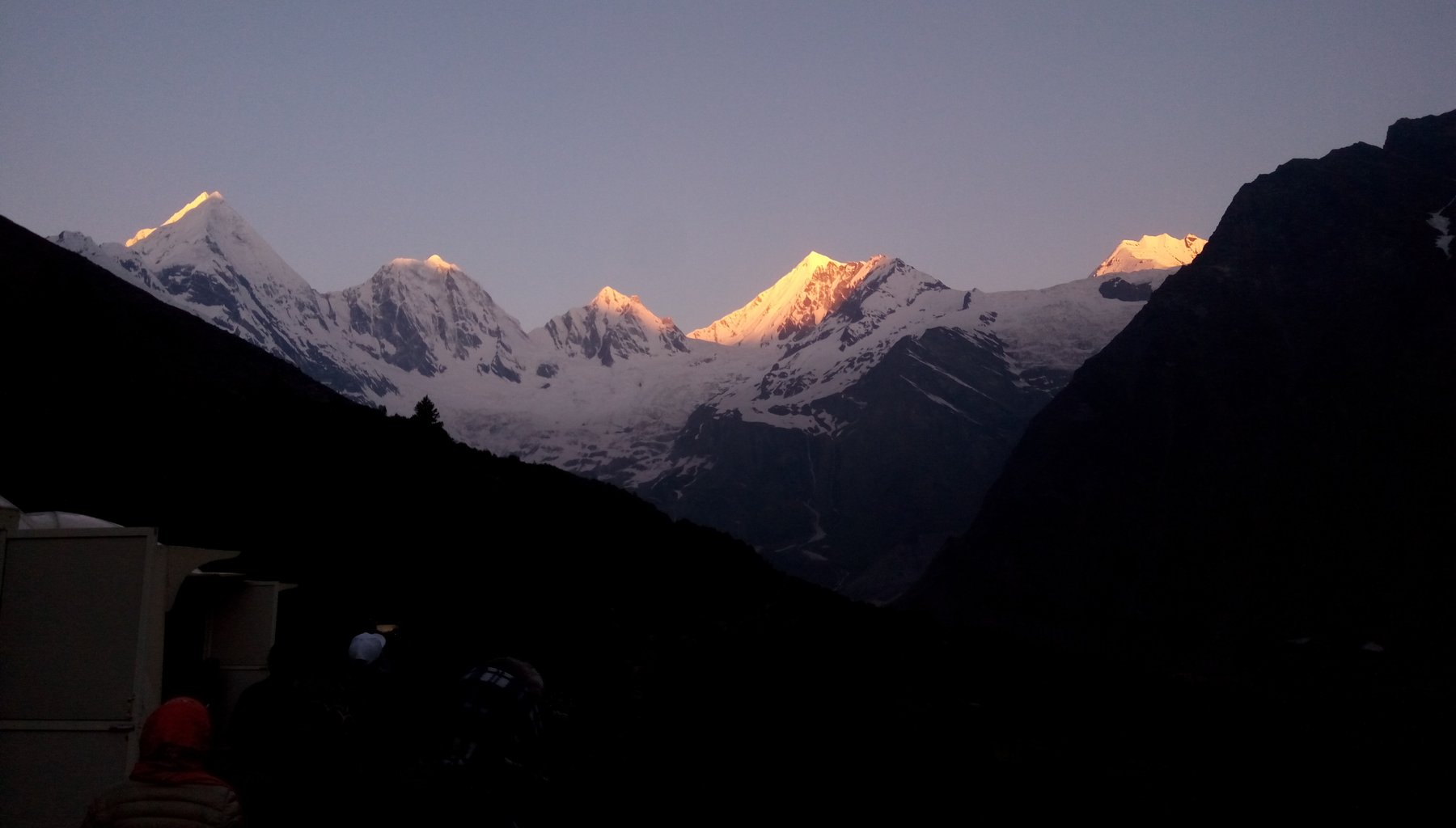The five snow-covered Panchachuli peaks lit up at sunrise, seen from the Darma Valley